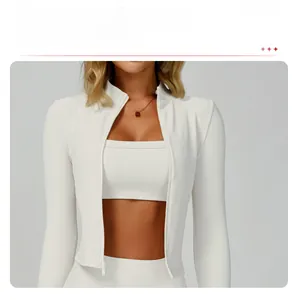 Detail of white rib-knit slim-fit yoga jacket showing stand collar and full-length zipper