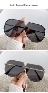 Detail of gold metal V-shape logo and woven texture on large frame sunglasses