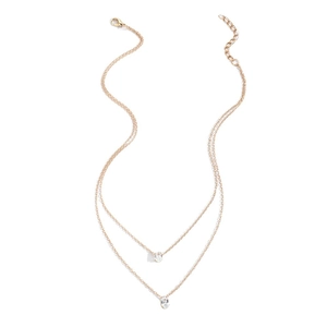 Double-layer gold necklace featuring oval zircon pendants in a minimalist layered design