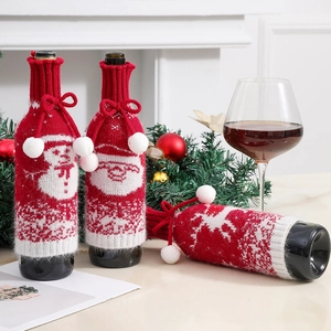 Knitted Christmas wine bottle covers with snowman and reindeer patterns for festive decor