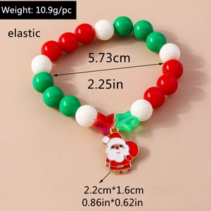 Detailed view of elastic Christmas beaded bracelet with festive Santa Claus charm