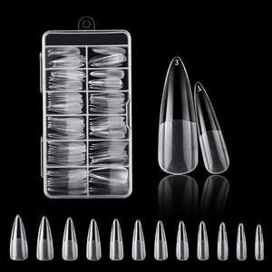 Macro view of clear false nail tips in various sizes with a transparent storage box