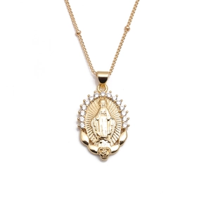 Gold plated copper necklace with Mary pendant and clear crystals on a white background