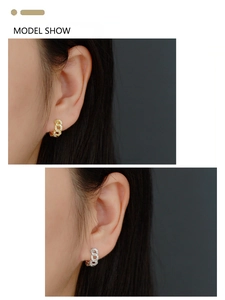 Detail of S925 silver chain hoop earrings with cubic zirconia in gold and silver finish