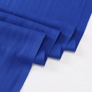 Close-up detail of soft blue cashmere-like scarf fabric texture on a white background