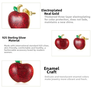 Detailed close-up of 925 sterling silver red enamel apple studs with gold plating finish