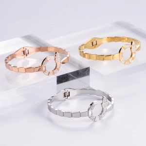 Elegant 18K rose gold and silver snake scale bracelets with white shell inlay and crystals