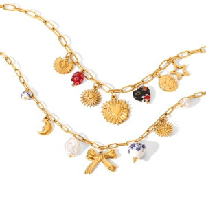 Gold stainless steel layered necklace with sun moon heart and bow charms on white background