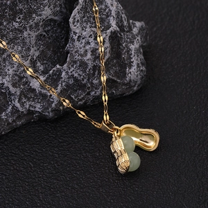 Gold titanium steel necklace with peanut shell pendant and two light green beads
