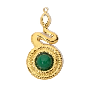 Detailed view of a gold snake pendant with green gemstone and textured scales