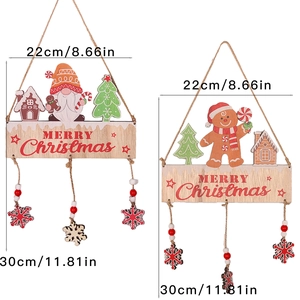 Detail of wooden Merry Christmas hanging ornaments with gingerbread and gnome patterns