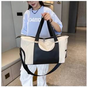Detailed view of large sports tote bag with black and white color-block design