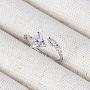 Macro shot of silver adjustable floral ring with sparkling marquise cut zircons