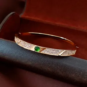 18K gold plated vintage bangle with round green gemstone and pavé zircon inlay