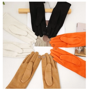 Flat lay of warm faux suede gloves in four colors featuring heart touchscreen fingertips