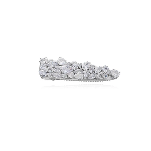 Macro shot of silver hair clip with teardrop and marquise micro-set zircons on white base