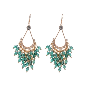 French palace style gold drop earrings with green crystal tassels and sparkling rhinestones