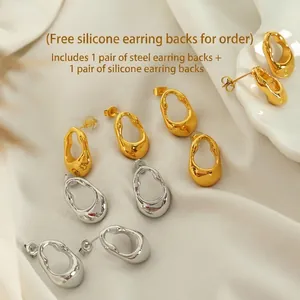 French vintage style irregular teardrop stud earrings in gold and silver polished metal
