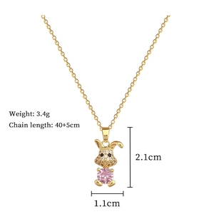 Detail showing dimensions of gold bunny pendant necklace with pink and white crystals