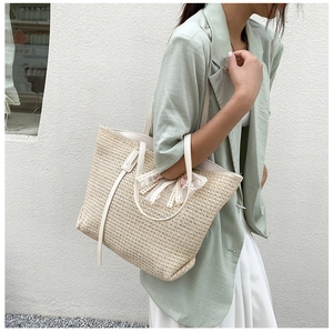 Straw woven tote bag in oatmeal beige with lace bow detail and slim shoulder straps