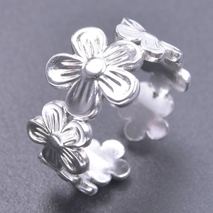 Minimalist silver floral open ring featuring multi-flower petal design and adjustable band