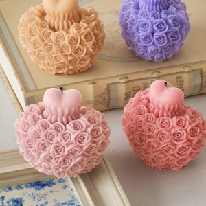 Detailed view of heart-shaped rose bouquet candles in multiple pastel colors