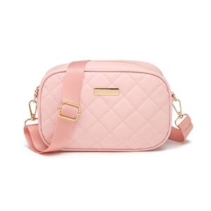 Pink quilted crossbody camera bag with adjustable fabric strap and gold hardware