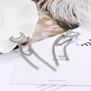 Silver tassel cuff earrings with rhinestones and chains on a clean white display background