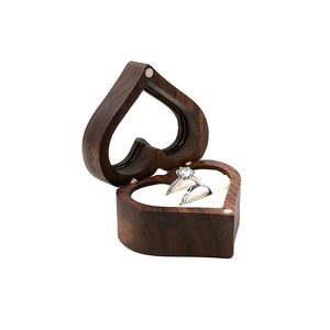 Handcrafted heart-shaped walnut wood ring box with white velvet lining for two rings