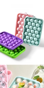 Detail of 25-grid silicone ice ball trays in multiple colors with small round ice spheres