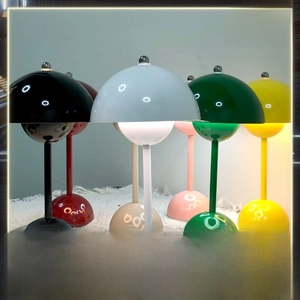 Close-up of portable flowerpot lamps in six colors with metallic finish and touch dimming