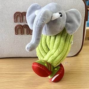 Detail of creative elephant plush keychain with green wavy knit texture and soft fabric shoes