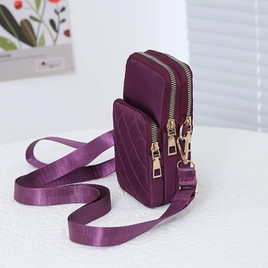 Three-layer purple quilted nylon crossbody bag with golden zippers for daily commute