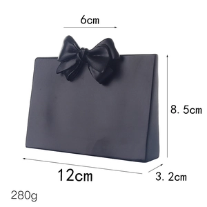 Black resin creative bow handbag jewelry display stand with detailed dimensions