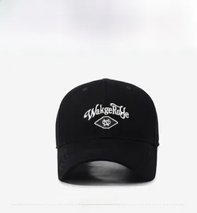Detail of WakgeRoye embroidery on black cotton canvas baseball cap with curved brim