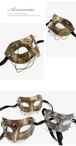 Detailed view of vintage punk masquerade half-mask with spikes and metallic hanging chains