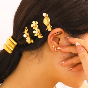 Chic gold mini earring set featuring shell, starfish and floral designs with pearls