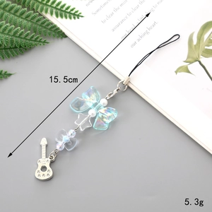 Blue acrylic bow and silver guitar pendant phone charm keychain measuring 15.5cm length