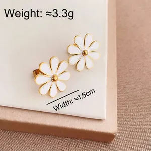 White daisy stud earrings in titanium steel with gold flower center and petals