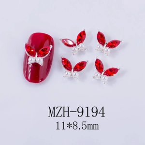 Detail of red butterfly nail charm with marquise rhinestones and pearls, size 11x8.5mm