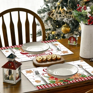 Christmas gingerbread man placemats with red plaid and white stripes on a wooden table