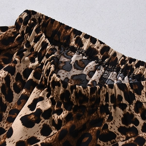 Detail of the elastic waistband and stitching on the leopard print high-waist maxi skirt