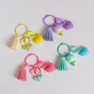 Set of four colorful resin tulip keychains with matching suede tassels and heart charms