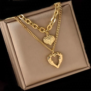 Double-layer gold titanium steel necklace with angel wing heart pendants on box
