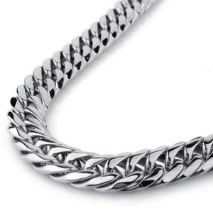 Macro view of silver stainless steel Cuban link chain with polished finish and thick texture