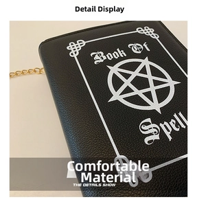 Detailed close-up of gothic book-shaped crossbody bag with pentagram and Book Of Spell print