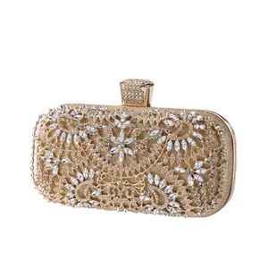 Luxurious gold evening clutch bag with sparkling floral rhinestone patterns and top crystal clasp