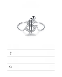Macro view of 925 sterling silver belly button ring with dollar sign and chain details