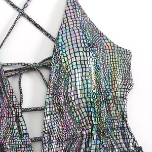 Detail of laser holographic swimsuit with crocodile texture and lace-up back design
