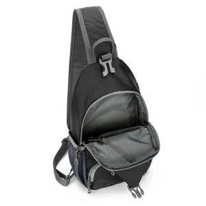 Detail of multi-pocket nylon outdoor bag showing internal grey lining and zippered storage